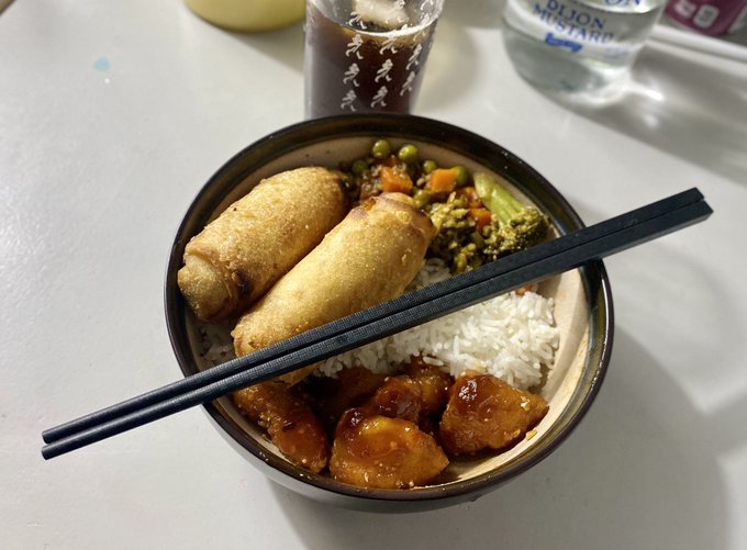 Nom nom. Homemade sweet and sour breaded cauliflower, garlic black sauce veggies and veggie eggrolls