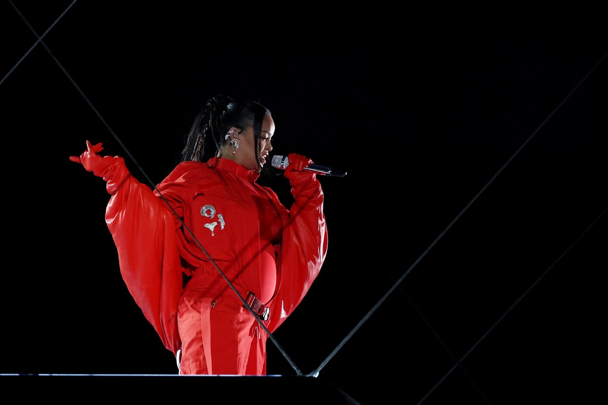 Rihanna reveals she is pregnant with her second child during her Super Bowl Halftime performance.