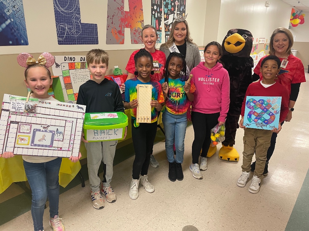 Miss Gaston County Erin Emiroglu visited Hawks Nest STEAM Academy for the “One School, One Book” assembly that celebrated the students reading a book about toys and then creating their own toys. Erin enjoyed sharing with the students and seeing the toy projects they made.