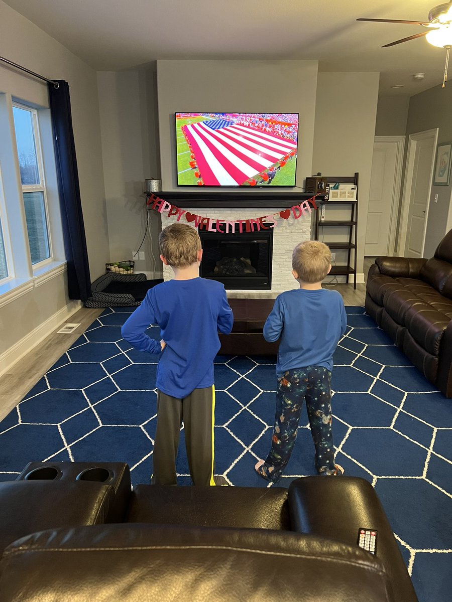 NickMBush's tweet photo. We always stand for the National Anthem in this house! Even when it’s on TV! #SBLVII  #teachemyoung  #teachemright https://t.co/DmTjwuxjoM