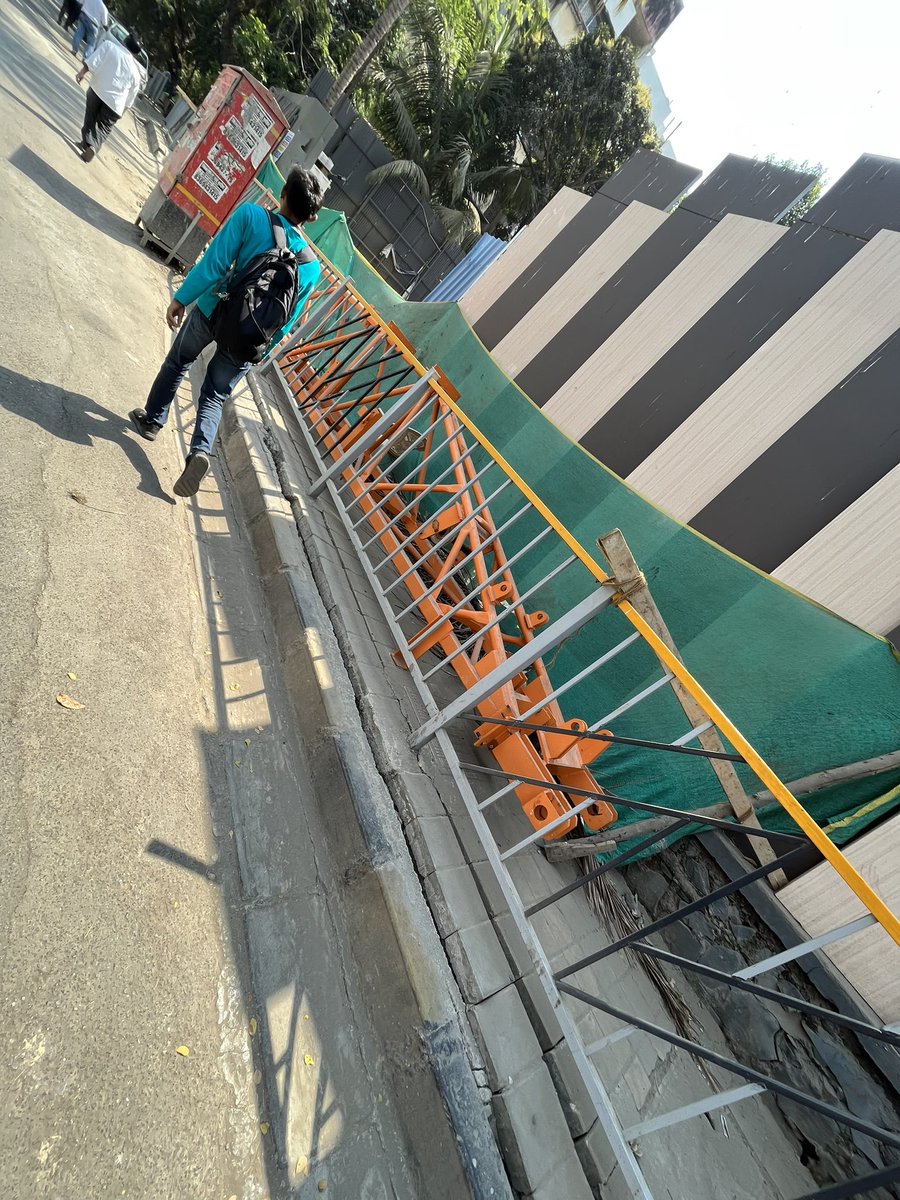 Harsh_Doshi_'s tweet photo. Where do we walk?? This footpath is illegally captured by the builder for his own personal work. Remove this asap! 
It is dangerous to walk on road Location: Road towards Kandivali West Metro station, Mahavir nagar opposite to Donna’s pizza @mybmcWardRS @mybmcWardRC @mybmc https://t.co/wRzVSOVHkV