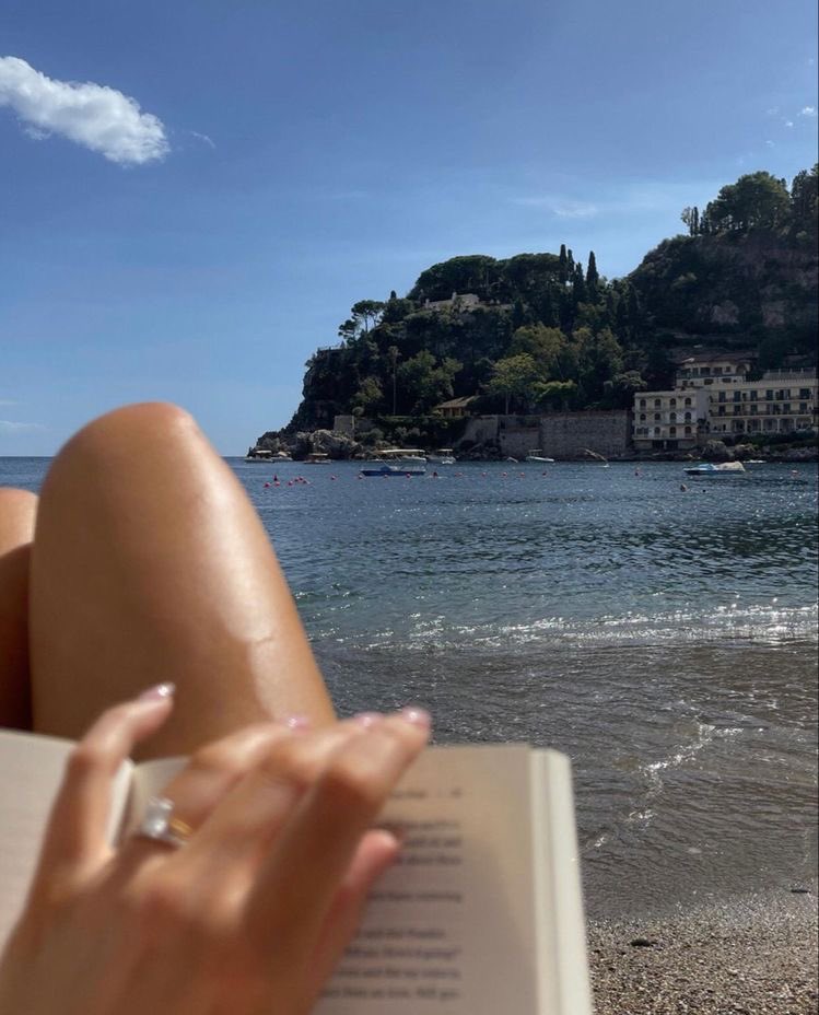 oh to be by the beach in another country reading a romance novel