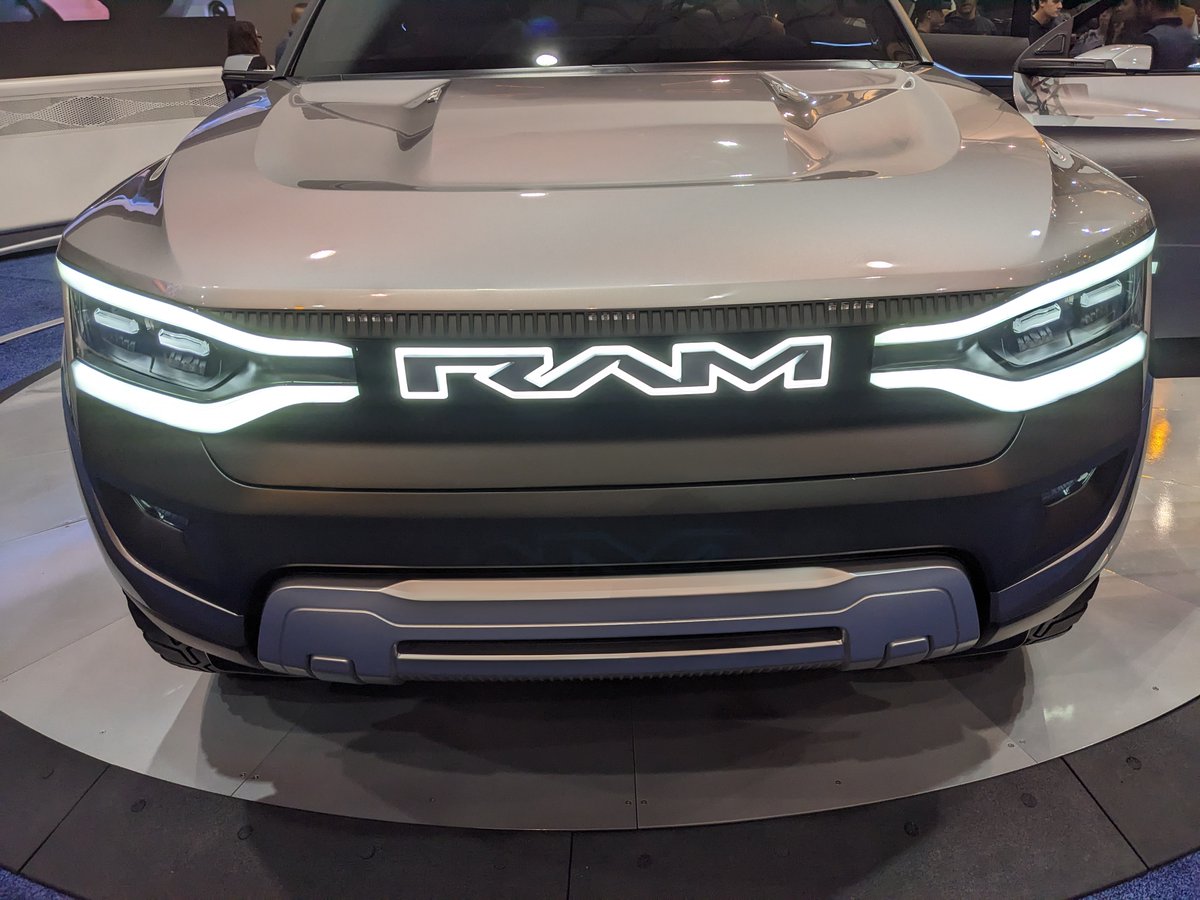 TalkTesla's tweet photo. Checked out the RAM REV this weekend at the Cleveland auto show, some takeaways:

- Overall stylish, futuristic
- Suicide side doors were cool
- Cabin is crazy massive
- Super tiny side mirrors
- Tailgate split left and right

Most Obviously Missing: NO listed specs, delivery timeline, price whatsoever, hahaha!

Maybe they'll figure out some details by '25?