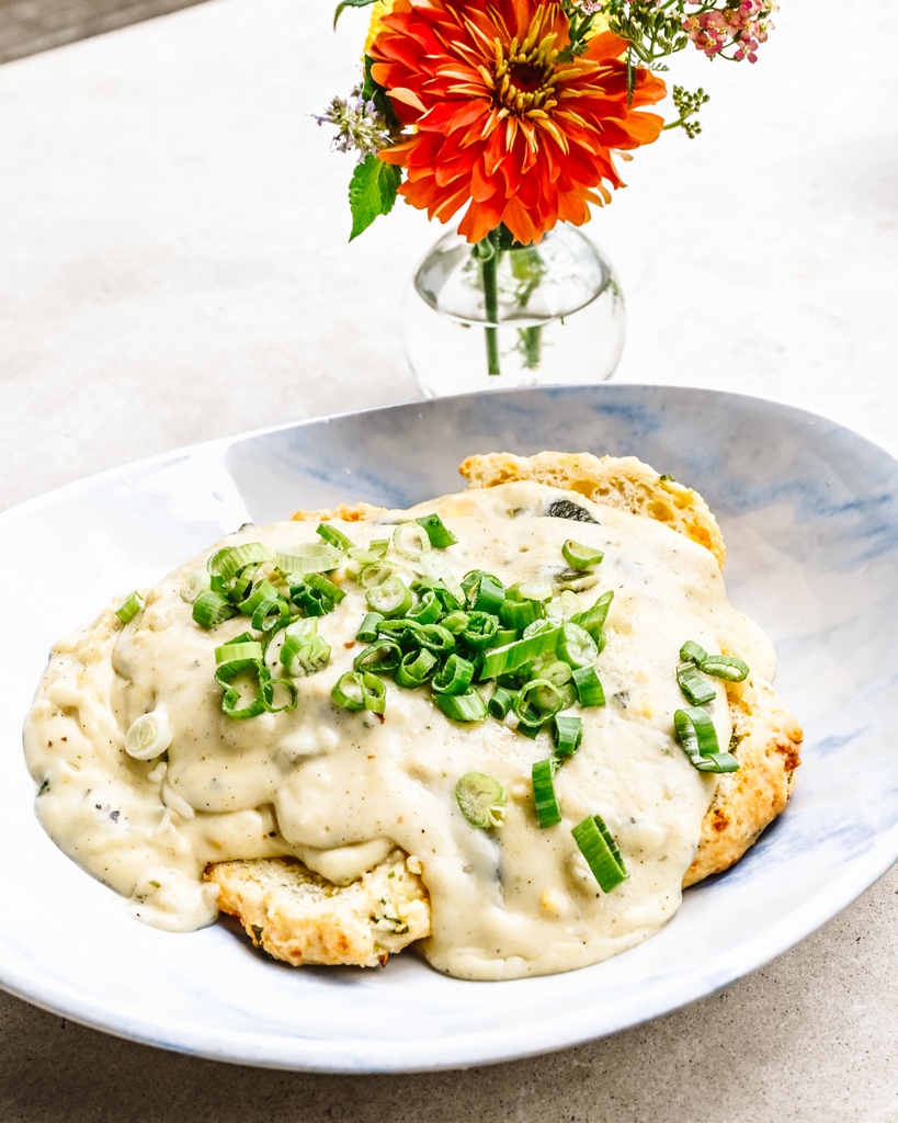 Two things that make a great weekend:⁠
✅ Biscuits⁠
✅ Gravy⁠
⁠
Lucky for us we serve brunch every Saturday &amp; Sunday until 2pm🥳, featuring our buttery and flakey cheddar biscuits, topped with roasted mushroom gravy and scallions.