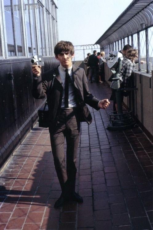 JohnFLyons2's tweet photo. To celebrate George Harrison’s 80th birthday, here is my favorite photo of him. He is on top of the Empire State Building in NYC in Sept 1963, at the age of 20. On this day, other tourists ignore him but 5 months later nobody would turn their back on George. https://t.co/IcC5XsNxaj