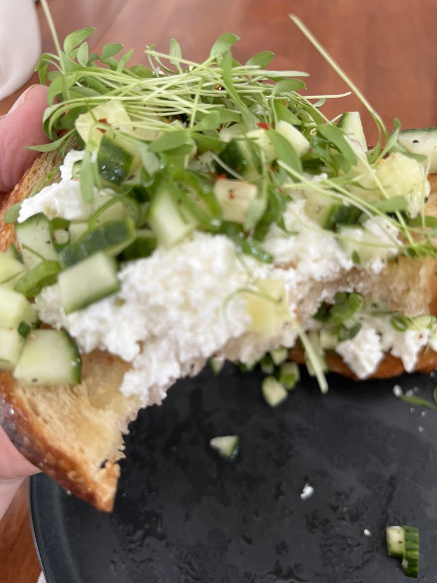 Cottage cheese toasted sour dough with a dilly salad on top inspired by @bakedbymelissa. Added some micro cilantro and red pep flakes. It’s SO GOOD