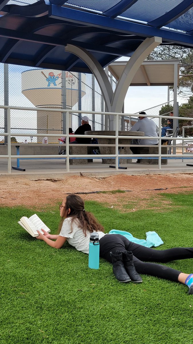 Perfect day for outside reading while brother plays t-ball. #SISD_READS