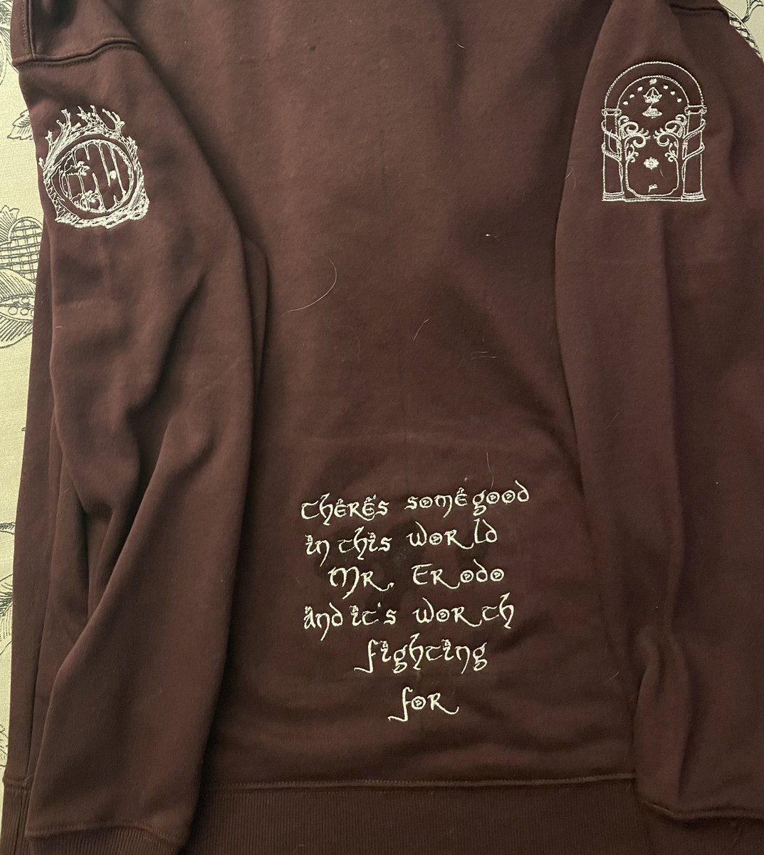 Front with sleeves, back with sleeves. Debating on putting Tolkein’s initial symbol above the quote. Let me know what you guys think