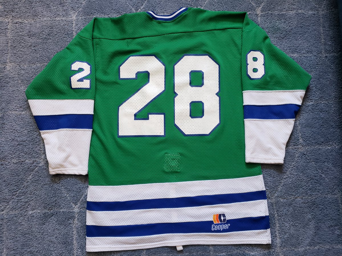 2RogueDubRacks's tweet photo. The Vintage look wins again this week. This 1987-88 @SeattleTbirds road Green was worn by winger Gary Grant. Nice wear on this Cooper mesh beauty. Gary was one of the toughest players to ever lace them up for the 'Birds.This team didn't win much in 88,but they were fun to watch. https://t.co/ejglzL0PRu