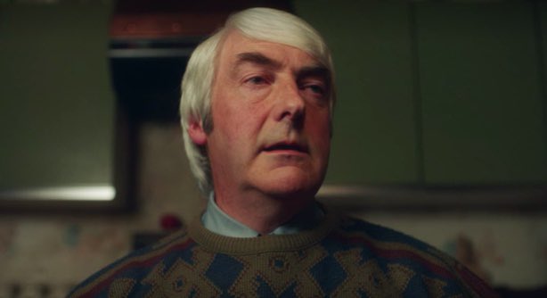 “I was on me walk like I usually go half ta  seven except on Mondays when I go at seven but it was Tuesday. An I noticed the feller standin there in tha rain. I says ta him, ‘mighty damp’ for it was rainin and he didn’t have an umbrella though he did have a balloon — red it was.”