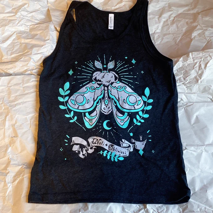 SHIRTS! ARE! BACK!!!!!!!!!!!!! including a NEW MOTH TANK!!!  Theres also an updated LVL 7 and restock of Wave Boy and Bad Witch Club these will be at my table during emerald city and online afterwards  
