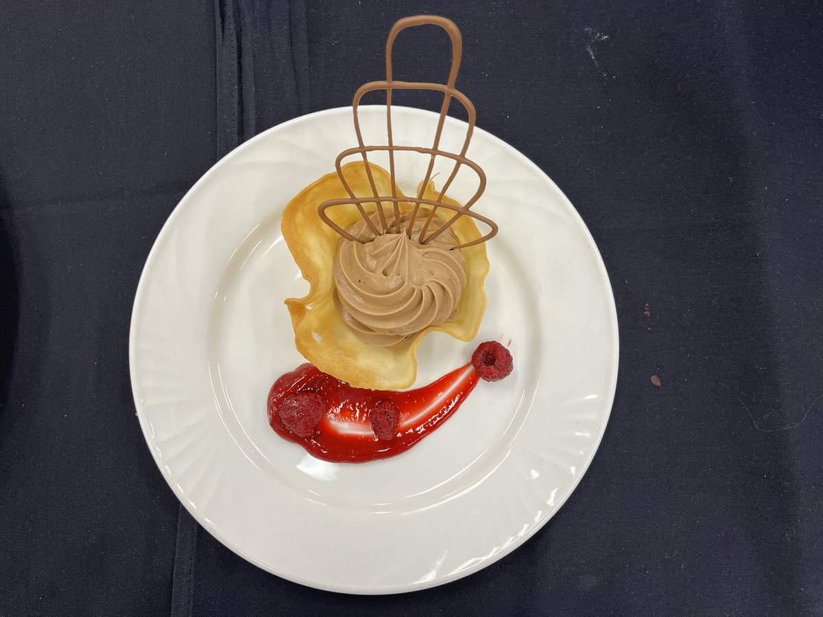 HSCCYeg's tweet photo. Brought to you by teams 13, 14, 15 &amp; 17…this is Caramelia chocolate mousse with raspberry fluid gel, tuile and chocolate garnish. Thanks for keeping up with us today for the High School Culinary Challenge. #hsccyeg #culinary #culinaryarts https://t.co/7HA21B1QGu