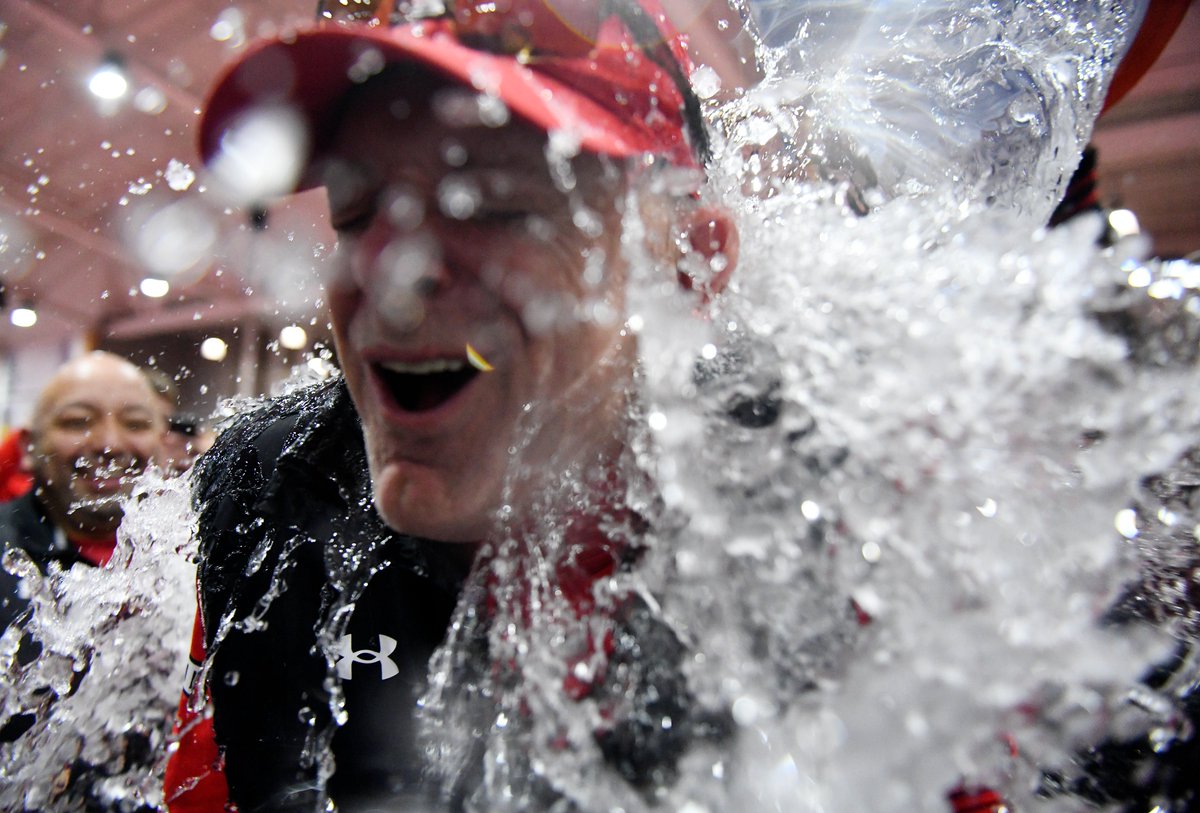Texas Tech athletes pour water on Texas Tech’s director of track and field and cross country Wes Kittley after the men's team becomes Big 12 indoor track and field champions, Saturday, Feb. 25, 2023, in Lubbock, Texas.