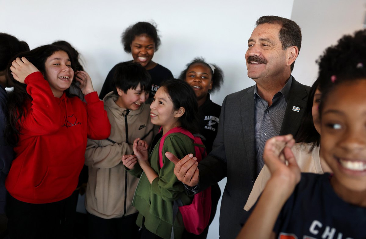 Chicago mayoral candidate U.S. Rep. Jesús “Chuy” Garcia has some fun with a group of kids while campaigning at La Antigua sports bar and grill in Chicago’s Little Village neighborhood on Saturday.