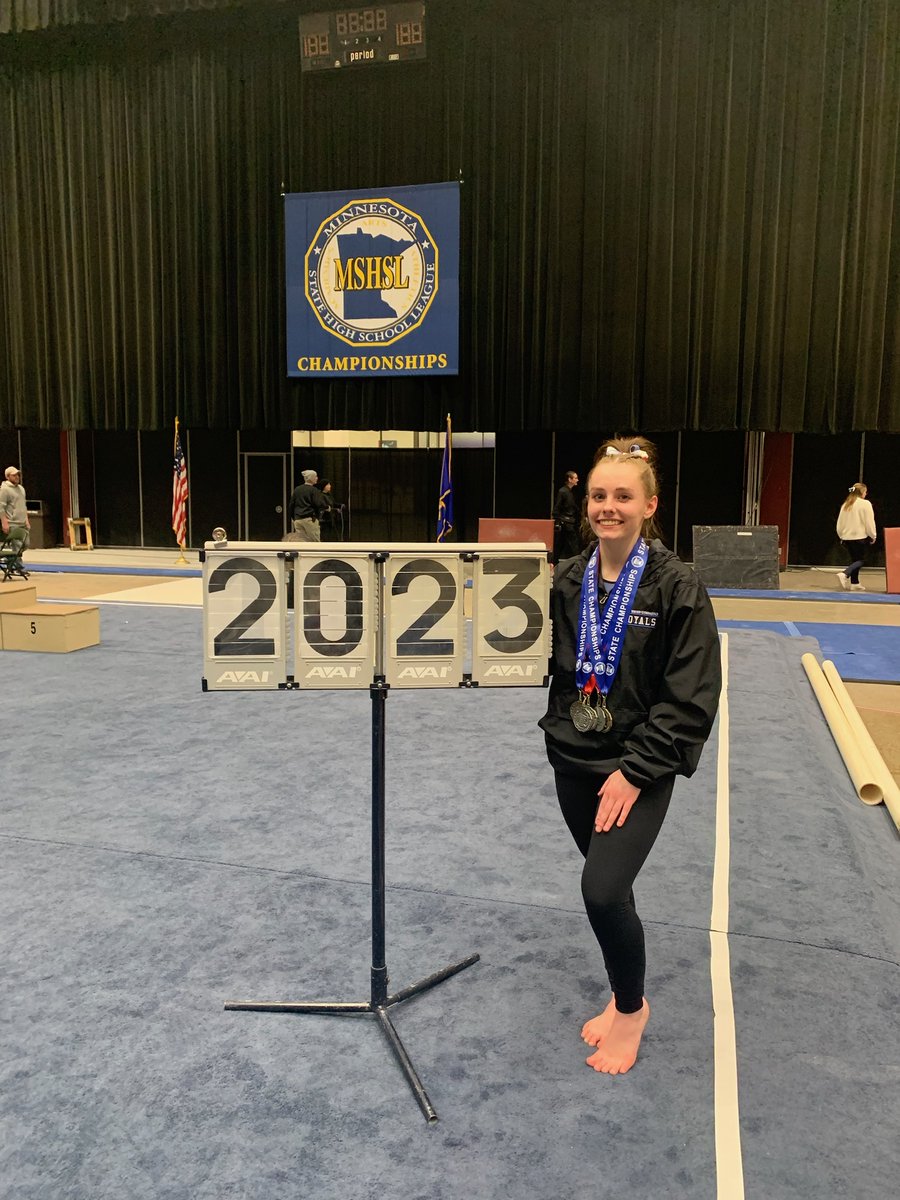 And here she is trying to balance with all those medals. Good thing she is a STATE CHAMPION Gymnast!! Reagan Kelley. Spectacular.