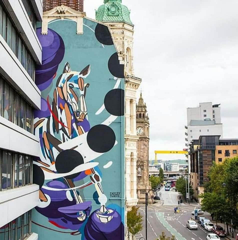 WalkingBelfast's tweet image. This fantastic mural in High Street, Belfast is called "High Horse" by fabulous Dublin artist @james_earley
James' family owned a stained-glass business in Dublin, Thomas Earley &amp;amp; Sons and his own distinctive style reflects his artistic past within Irish Stained-Glass Art