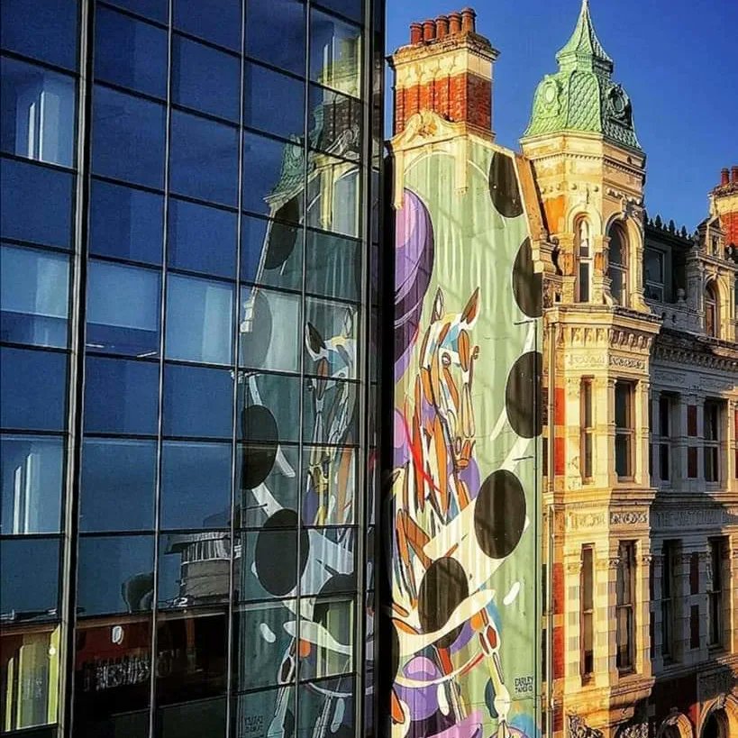 WalkingBelfast's tweet image. This fantastic mural in High Street, Belfast is called "High Horse" by fabulous Dublin artist @james_earley
James' family owned a stained-glass business in Dublin, Thomas Earley &amp;amp; Sons and his own distinctive style reflects his artistic past within Irish Stained-Glass Art