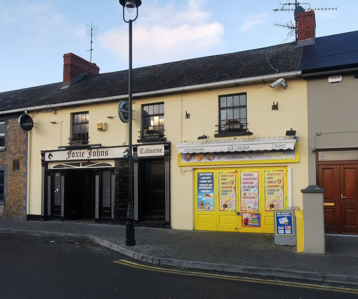 The home and business of Sean Etchingham in Courtown. This was one of several homes destroyed in official reprisals by Crown forces following the Inch Ambush where an RIC constable was shot and killed. Image following the reprisal and how it looks today.