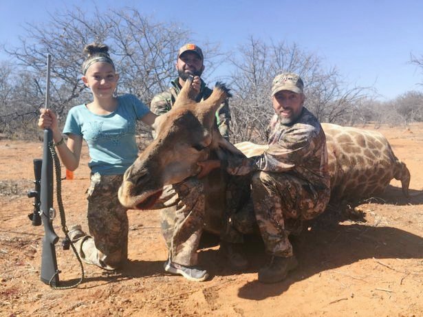 Look at the smirk on their faces! 💔 NO compassion for this innocent animal, no empathy! 🦒 #BanTrophyHunting now!