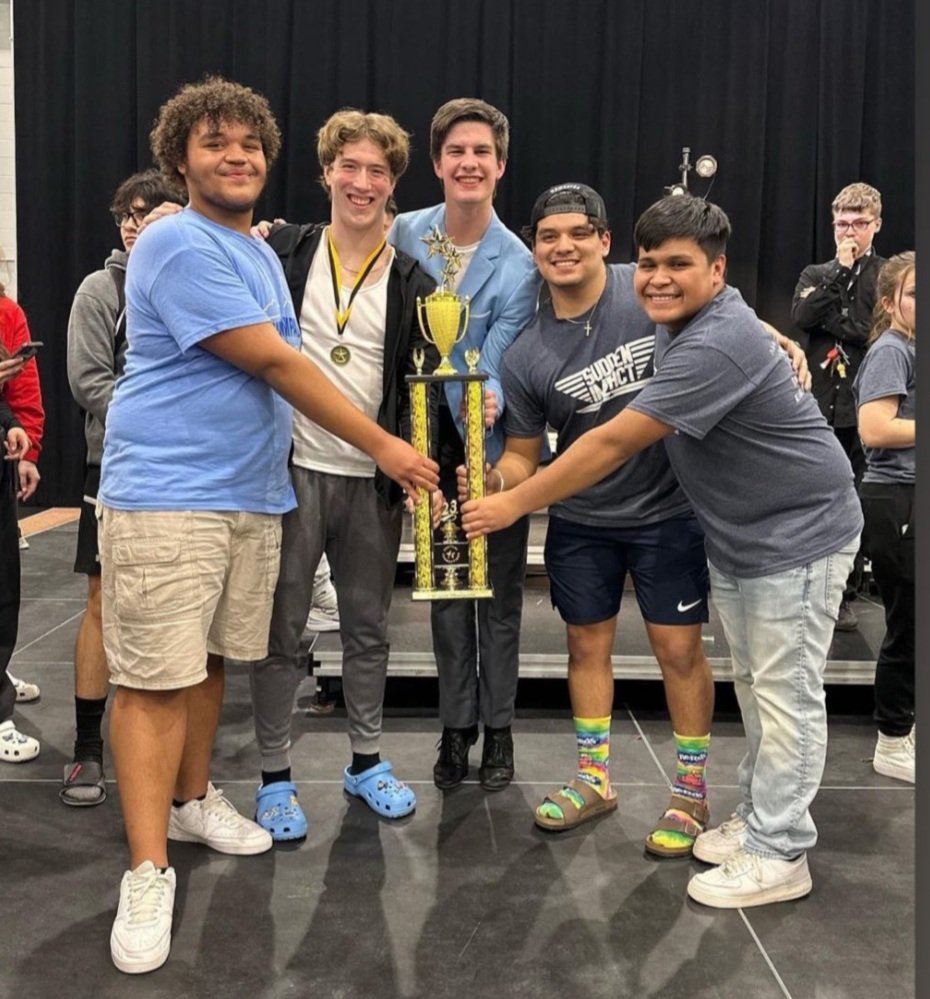 Congratulations to OHS Show Choir earning Grand Champion trophy this past weekend!! We spy a group of swimmers holding this much deserved Show Choir trophy!!