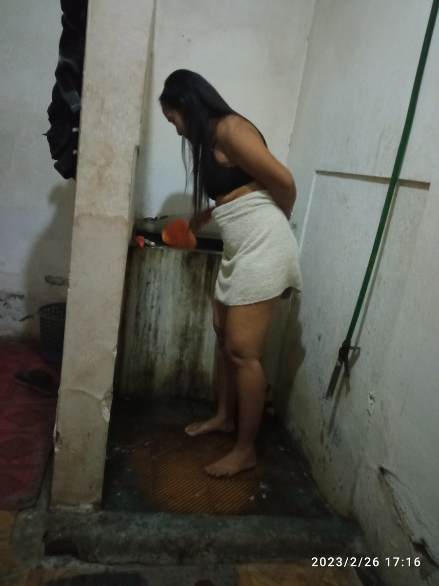 A stunning woman in a provocative outfit with a seductive expression ready to unleash her passion.