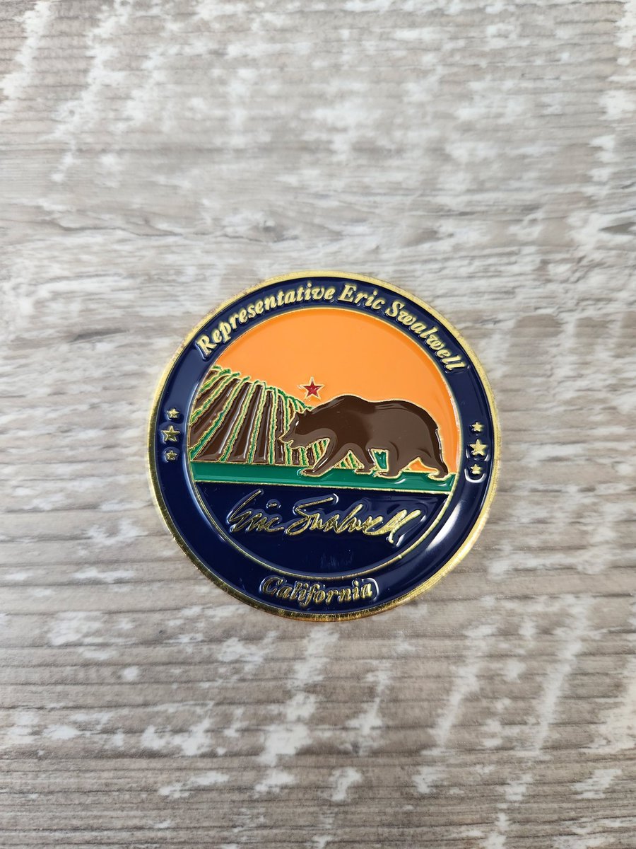 fred_guttenberg's tweet photo. At our Orange Ribbons for Jaime Gala, I was thankful that my friends Brittany and @ericswalwell joined us.  He gave me this challenge coin that he designed for his district.  The color orange is intentional.  My friend @jguttenbergot and I love you both. https://t.co/tfGxhgwWUO