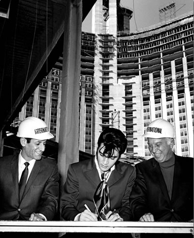 Elvis Presley signed a contract to perform at Kirk Kerkorian's International Hotel and Casino in Las Vegas, NV at a ceremonial signing on Feb 26, 1969, with the resort still under construction behind him. bit.ly/1fJDW5i bit.ly/2GOWVwx