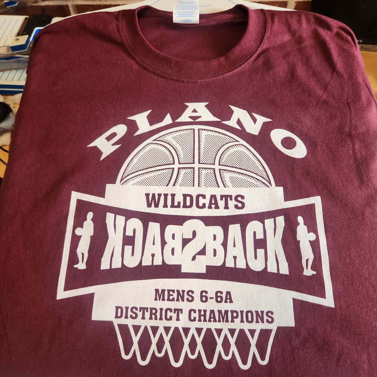 We've made shirts which are maroon commemorative Back2Back District Championship on fronts &amp; playoffs on backs for the regional quarterfinals playoff game on Tuesday. The introductory costs are $15 &amp; $17 crew &amp; Vnecks, resp. 
Thanks,
Janice@TexasDecoratedApparel.com