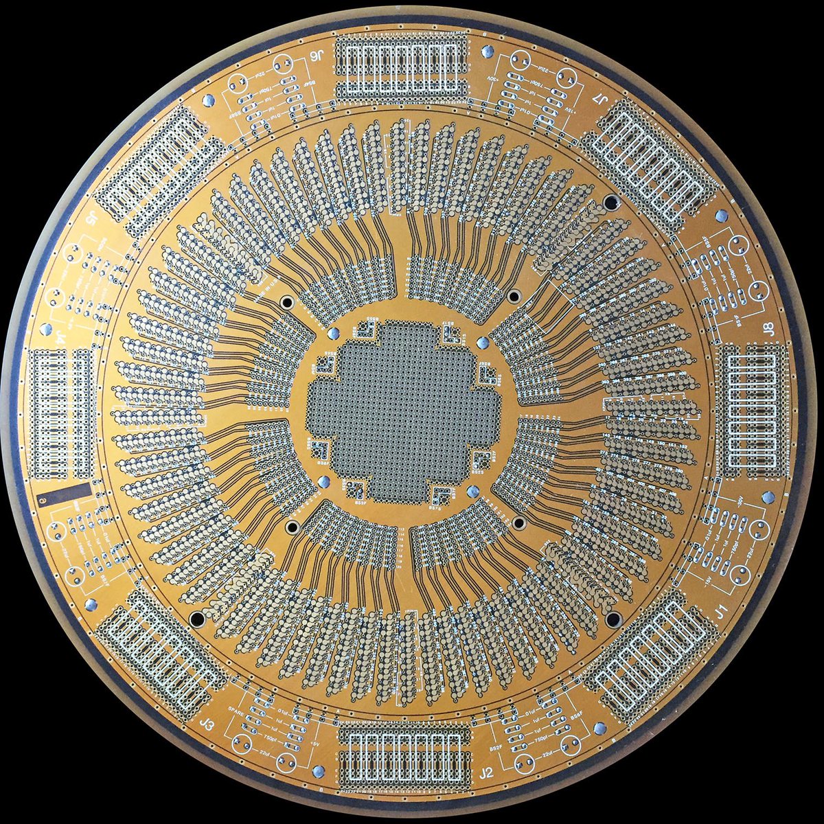 Siliconinsid's tweet image. This very thick and heavy PCB is a probe board, designed to test individual chips on a silicon wafer. There’s not that many round PCBs, the symmetry is quite amazing.