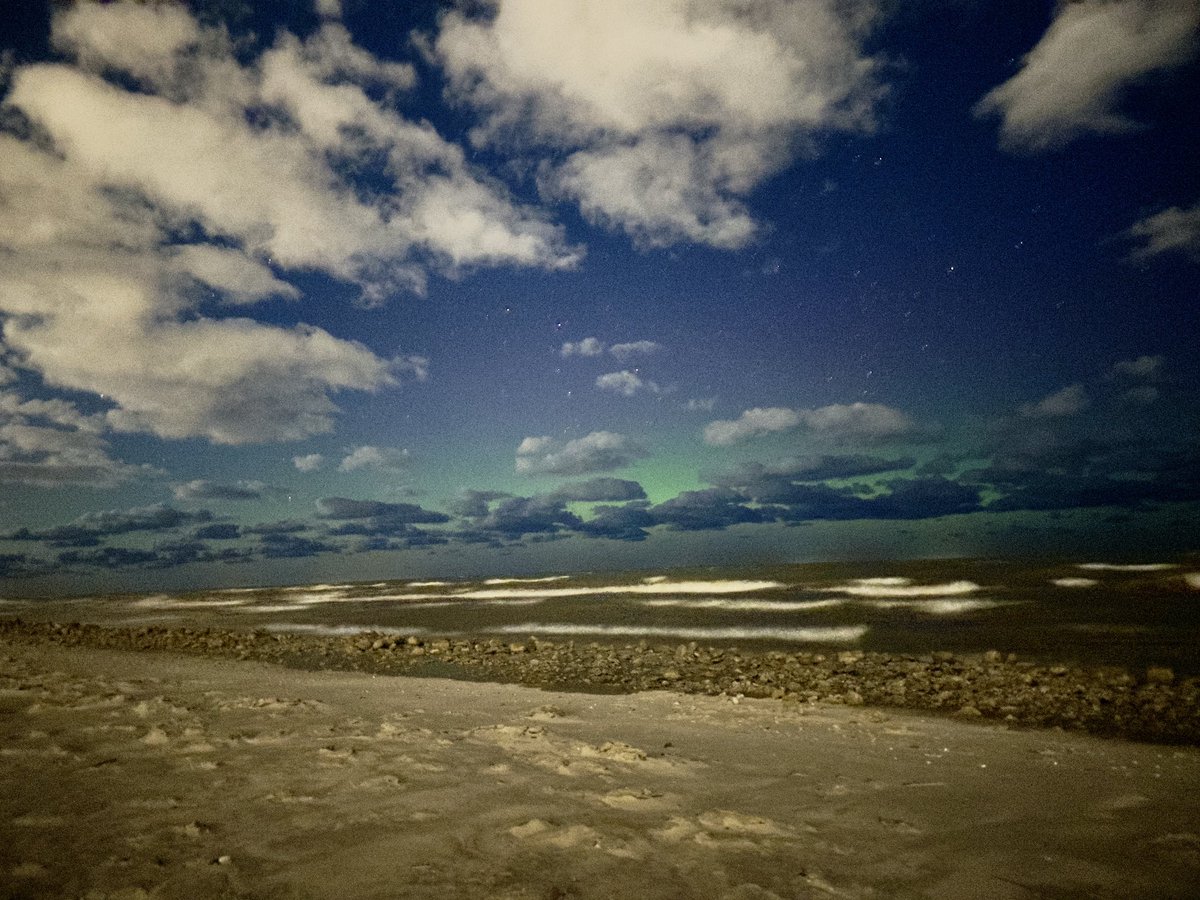 EricSnitilWx's tweet photo. SPOTTED! The northern lights came out to dance over Rochester tonight. Lake effect clouds eroded just enough to see the green glow. If you look close, you can see a subtle layer of pink in there, too. #ROC https://t.co/YnyYi5HtEe