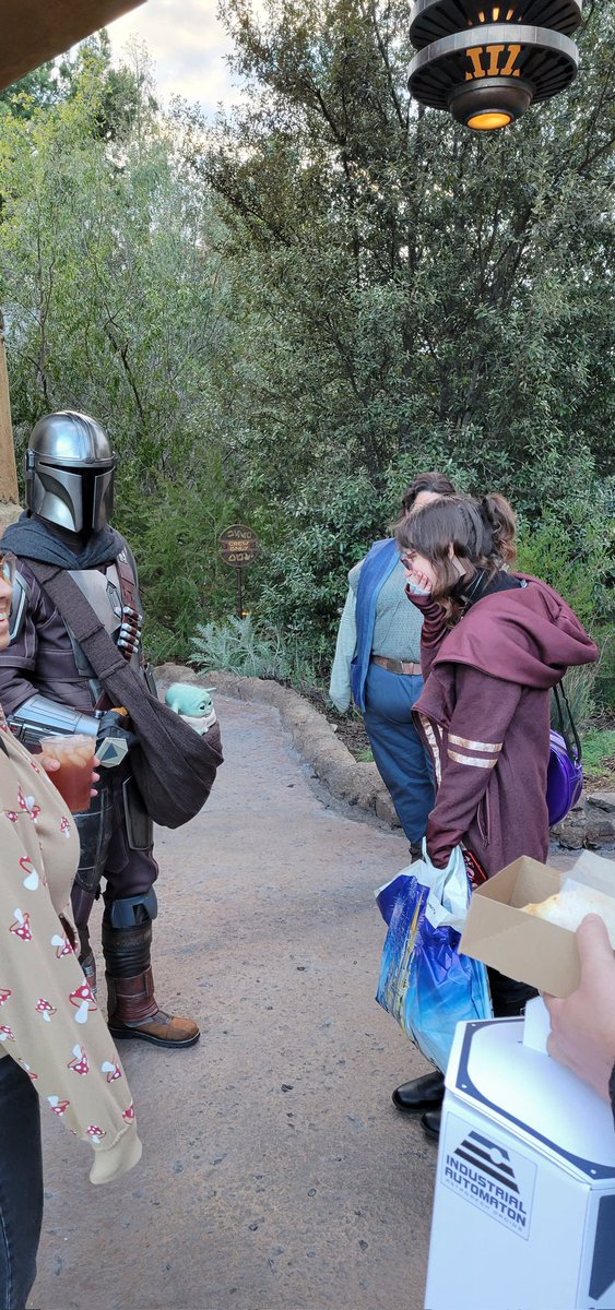 FairyoftheDead's tweet image. Din approached me today and I am still smiling 4 hours later. Nearly cried when I noticed Grogu and it sounded like he said "I love you."  
Din: You look nervous. Are you on the run?
Me: Yes running towards *smirk* 

#swge #DinDjarin
#grogu #Mandalorian #Disneyland