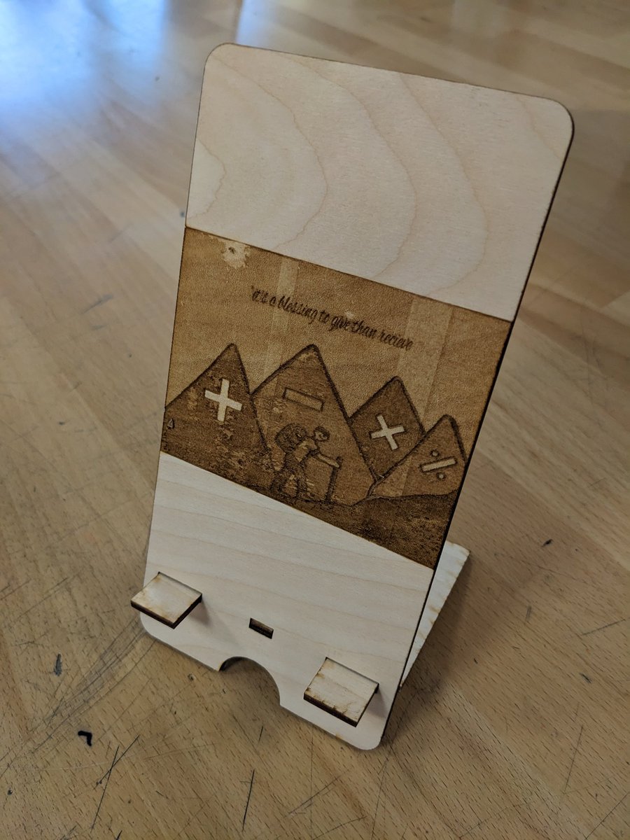 mathandmaths's tweet photo. Some very sweet middle school students made a phone holder for me during their tech class. I love how personal it is: math and hiking. I especially love the middle school grammar of the quote. They were sooooo proud! https://t.co/5bj3EwIsrm
