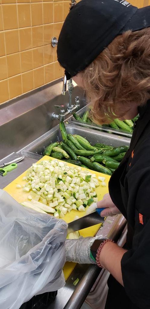 PHSCulinary2's tweet photo. PHS Culinary students spent the day at @FeedMoreInc chopping about 500 pounds of zucchini. Very rewardingexperiencefor them. @PowhatanHS @PowhatanSchools https://t.co/o6mj5vPd2a