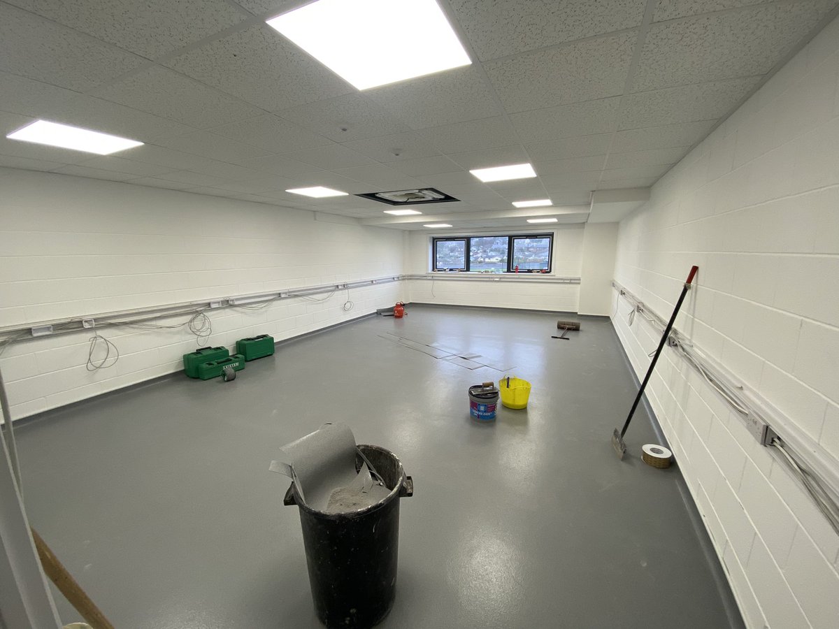 Classrooms being screeded then the floor installed.