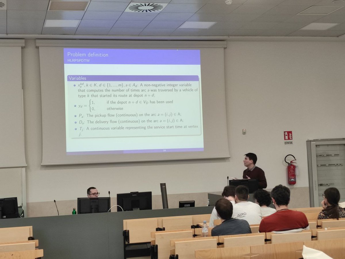 AIROyoung's tweet photo. #7AYW #Day1 #DecompositionMethods
Rafael Praxedes talks about a branch-cut-and-price for the VRP with simultaneous/mixed pickup and delivery, heterogeneous fleet, time windows, route duration, multiple depot, facilities location and symmetric costs in a unified problem. https://t.co/HxomydOW6l
