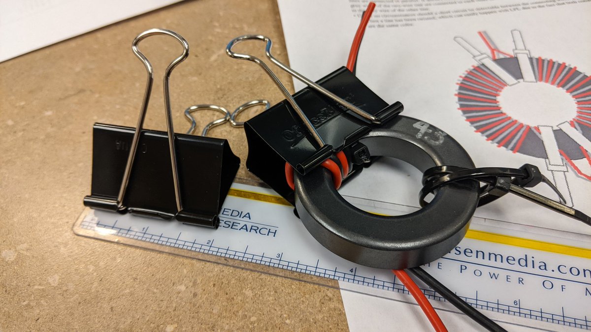DanLDEon's tweet photo. Project-at-work day. I'm winding some DG0SA common mode chokes. Each turn around the toroid can be pulled snug, but comes loose as I get to the next.
Huge binder clips FTW!
#hamradio #diy #tip https://t.co/joQ0GHrJ1i