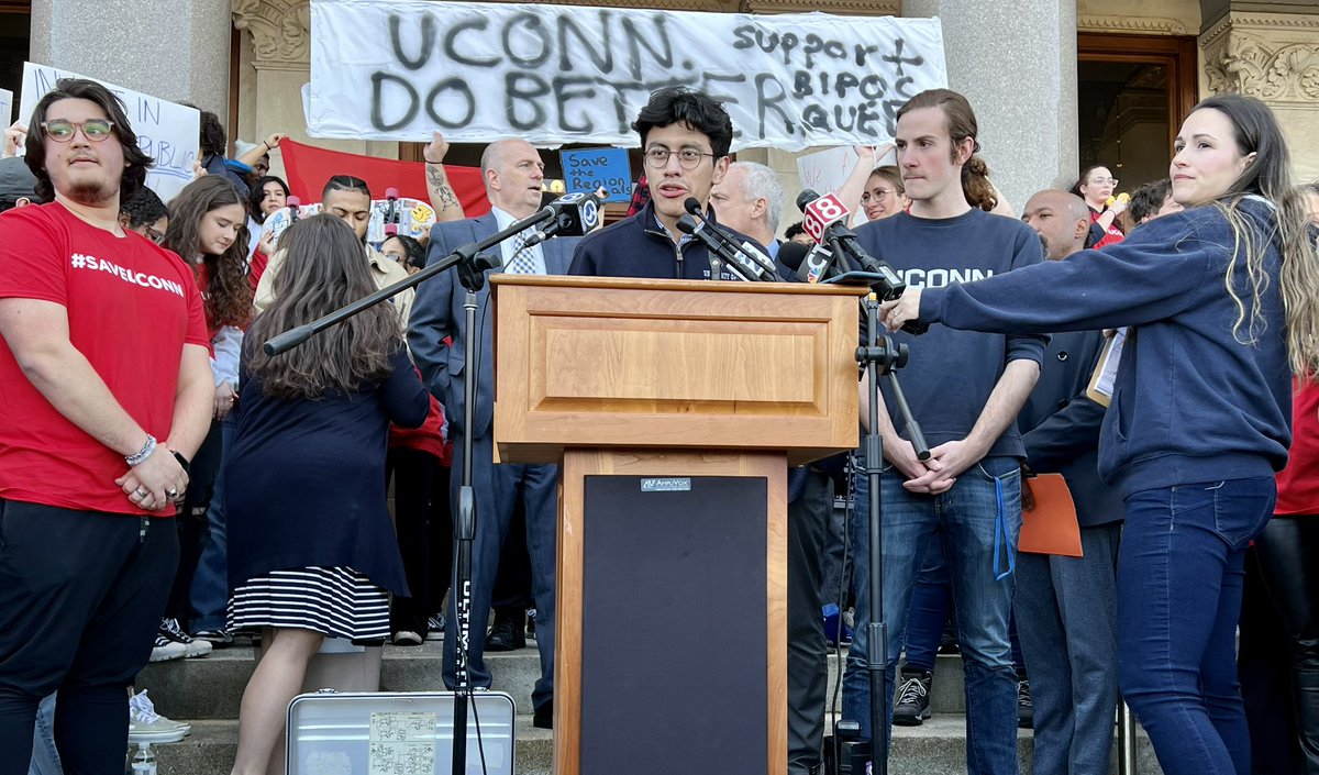 AFTCT's tweet photo. "Public funding is not just what makes @UConn’s regional campuses; it makes our state &amp; our nation!" @UConnStamford student body prez @nahum_valiente_ tells crowd rallying to #SaveUConn. #HigherEdNotDebt @AFTUnion @AAUP @UConnAAUP @SEBAC_CT https://t.co/YqSUPGgvqN