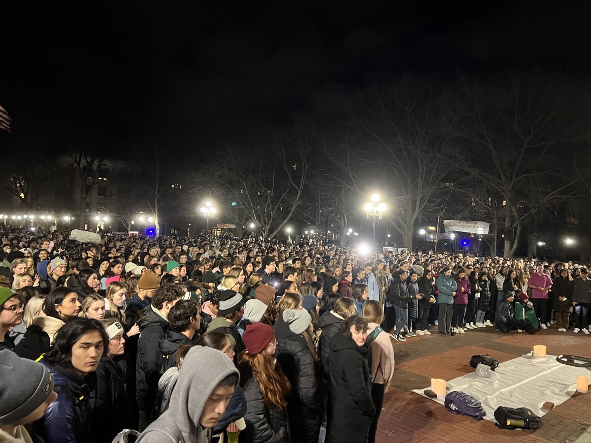 At least 1k here at UofM’s Diag, mourning those lost in the mass shooting at MSU. 

Students laid flowers on the Block M. A banner placed at the bottom of Hatcher’s stairs reads “Wolverines for Spartans”
