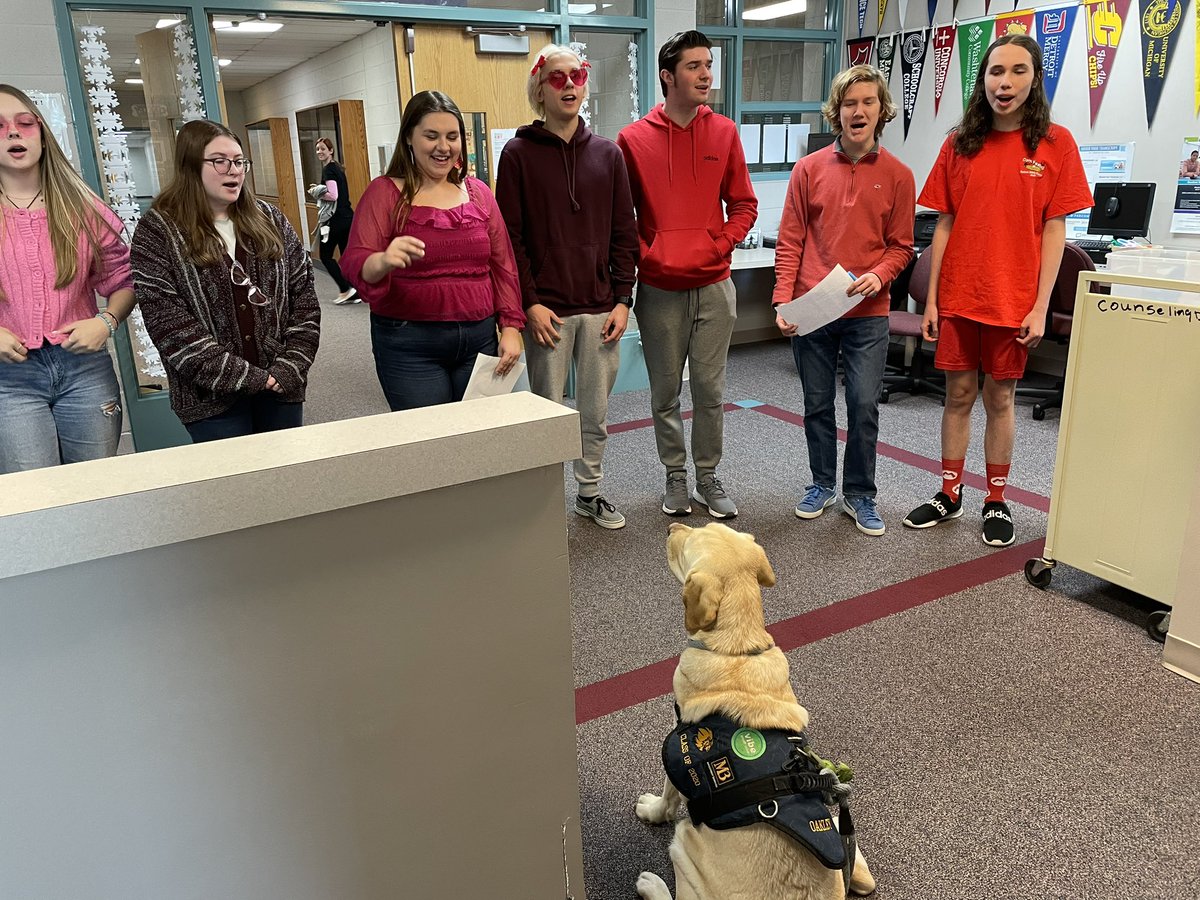 SLCSdogs's tweet photo. A day in the life of Oakley! Cheering on the unified basketball game, staying warm this winter and being serenaded on Valentine’s Day. https://t.co/t9atCgly8a