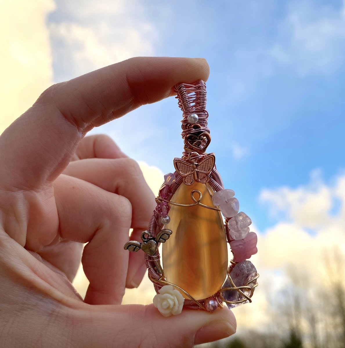 sunflower_c8e's tweet photo. i have been wearing this pendent of mine that never sold last year and i have been getting so many compliments on it. i have forgotten how much my art makes me connections. i miss creating so much. i think i’m gonna make some new pendants soon. 🥺 https://t.co/weFLfxigfR