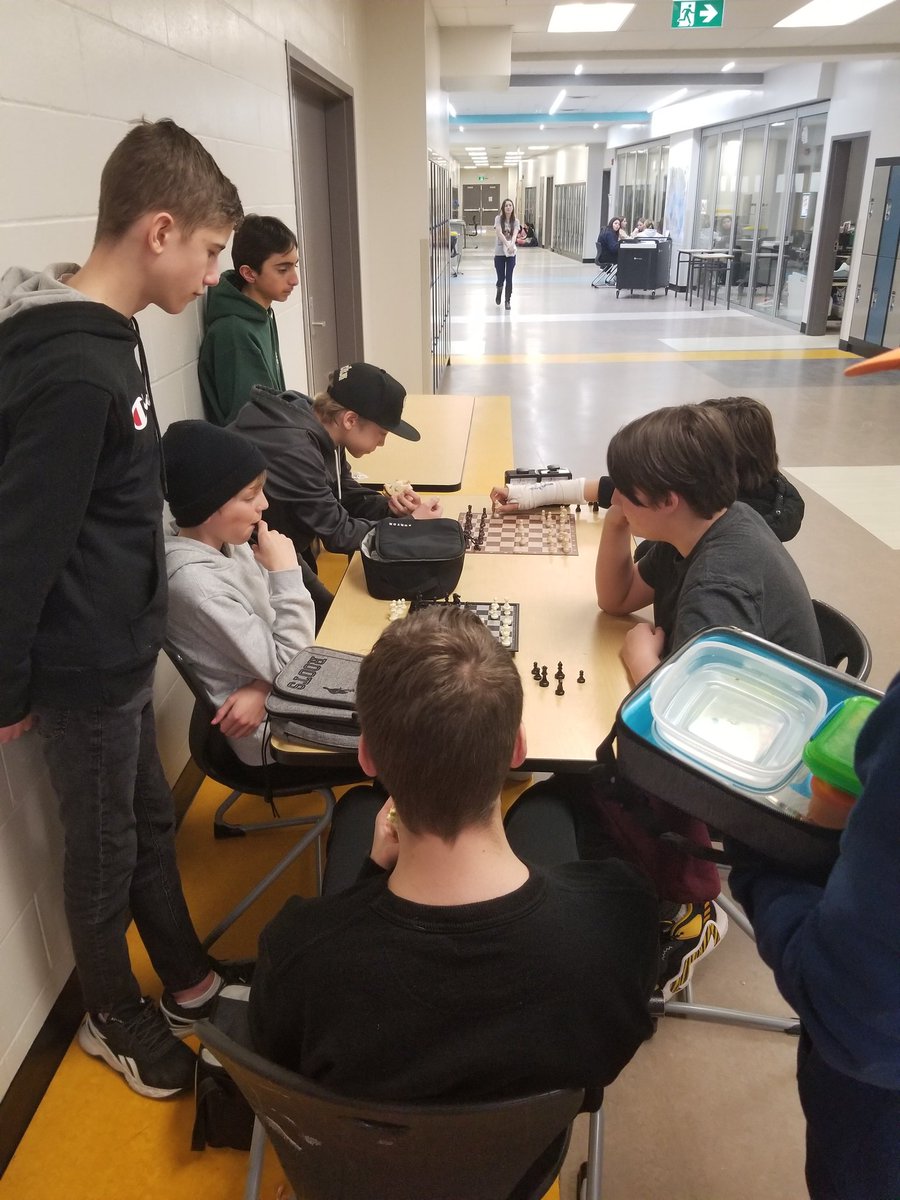 csmalette's tweet photo. When people ask why we are an #awayfortheday school, it's because I love watching a quiet gaggle form around a lunchtime chess game. I should have snapped another pic because when I walked by again the crowd had tripled... #wearecbe #techfreetime #unplug https://t.co/vF85rtFoqS