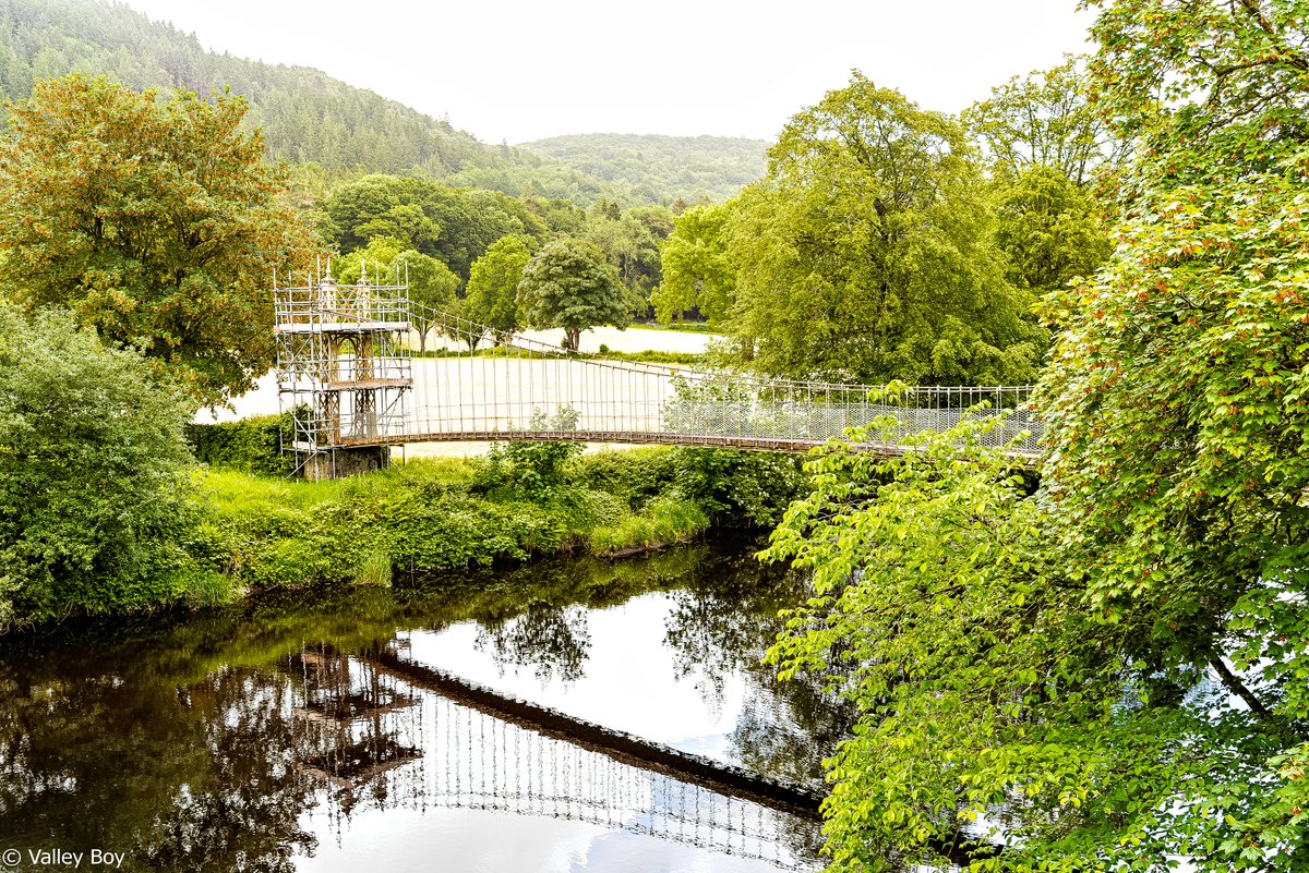 BJRoberts's tweet photo. A calm Afon Conwy flows beneath Betws-y-Coed's 1930 Sappers Suspension Bridge, in a verdant Eryri. @Ruth_ITV @ItsYourWales @northwaleslive @northwalescom @AllThingsCymru @OurWelshLife @NWalesSocial #Eryri #BetwsyCoed #AfonConwy #SappersSuspensionBridge #VerdantCountryside #Wales https://t.co/BthbQ1gJgb