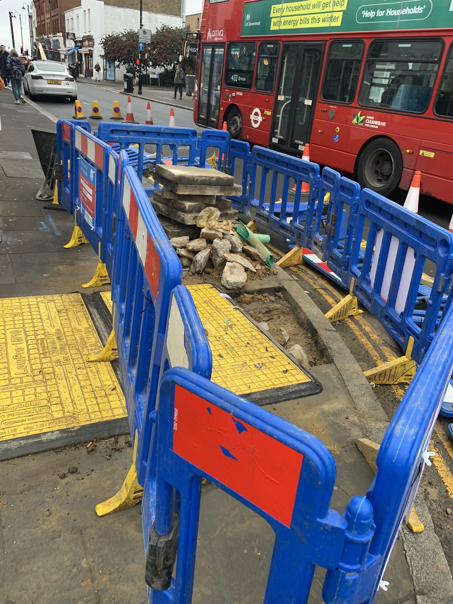 MerlinShoes's tweet photo. @thameswater pavement outside out shop has been dug up. Not seen one work person in the last two days. Barricades have fallen making it difficult for pedestrians https://t.co/AKLFYwKTWD
