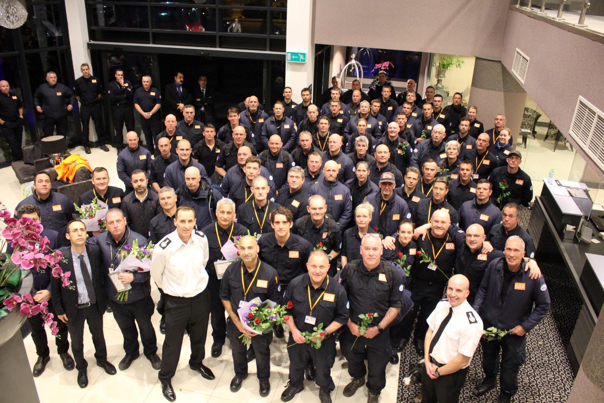 NFCC_FireChiefs's tweet photo. See the moment UKISAR team arrives home. The 77-strong team and 4 search dogs landed at Stansted airport to a salute from fire engines and a reception, including a representative from the Turkish consulate. @STN_Airport &amp; thanks to @ECFRS for capturing. https://t.co/jC15bCHLfv https://t.co/iYjaaXqSj4