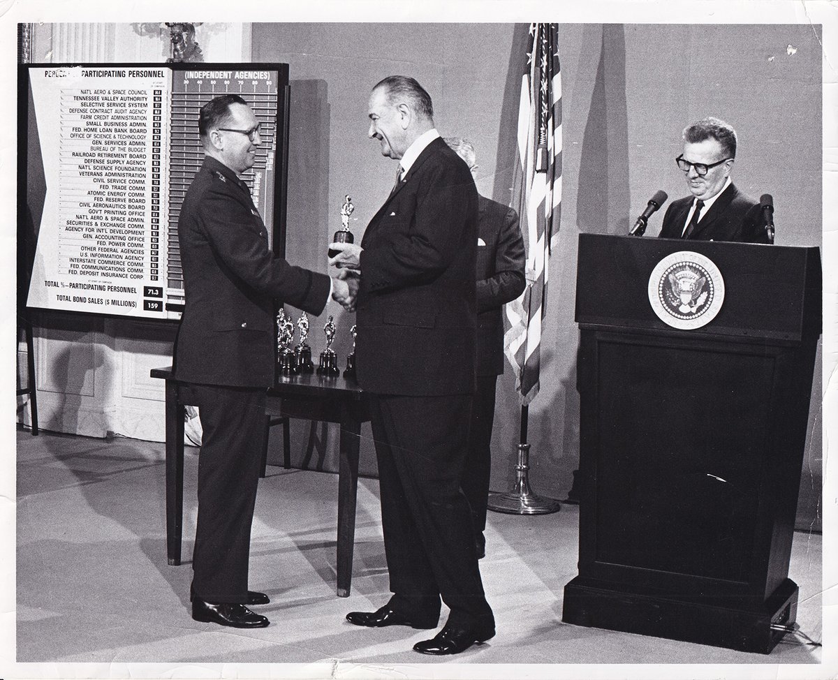 DLAMIL's tweet photo. #FBF Remember #Savingsbonds? In 1967 DLA's third Director Maj. Gen. Earl Hedlund received an award for 90% savings bond participation from President Johnson at the White House with Postmaster General Lawrence F. O'Brien (right). #DLAhistory https://t.co/09zhnjF2wU