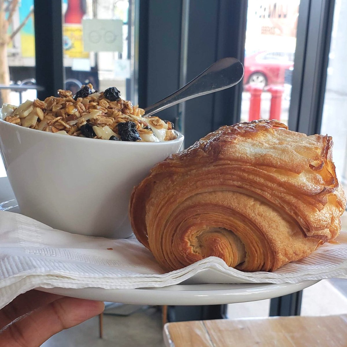 Starting the day off with a delicious breakfast - yogurt topped berries, granola, and honey accompanied by a delicious croissant from Condesa Coffee. #breakfast #atlfoodie #shoplocal