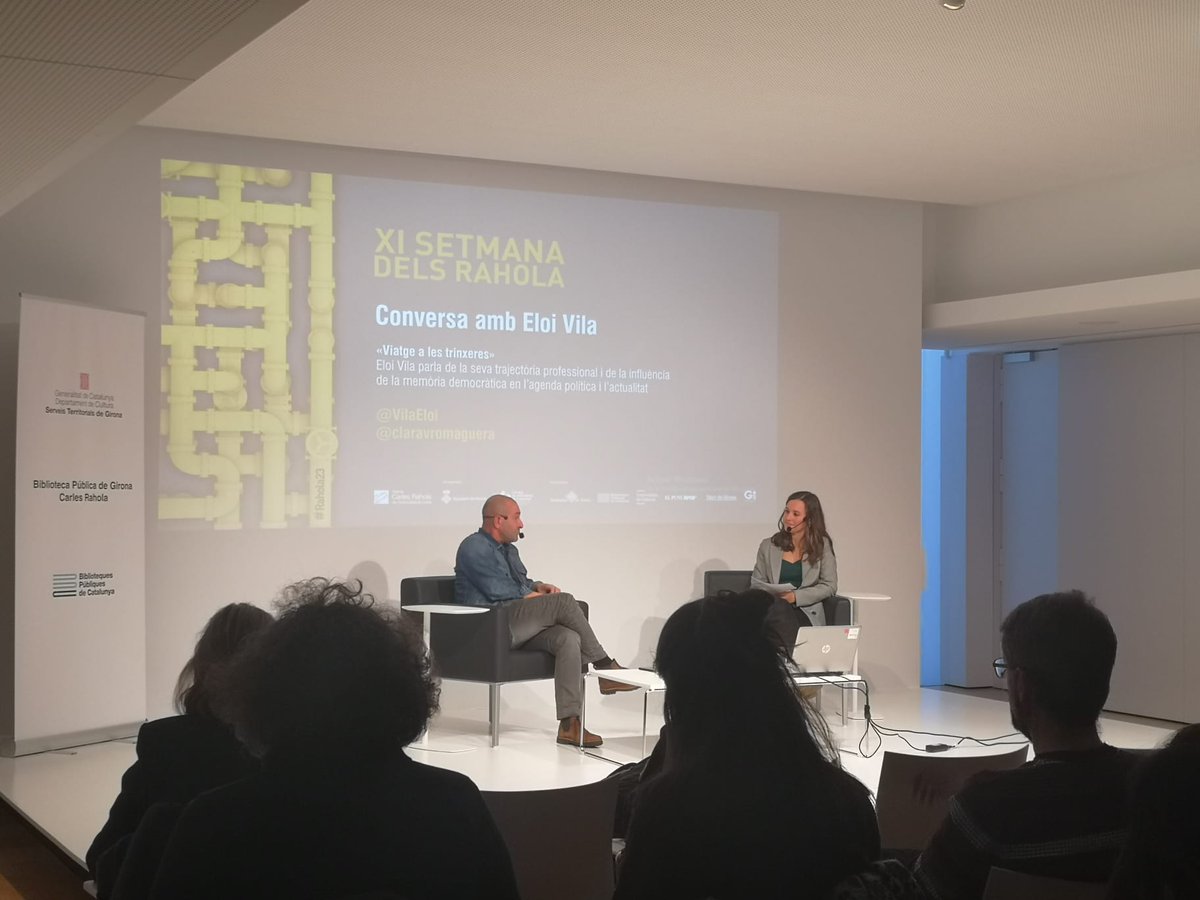 bprahola's tweet photo. Ara mateix conversa d'Eloi Vila amb Clara Vicenç a l'auditori Enric Mirambell i Belloc de la #BiblioRahola
👉 XI #SetmanadelsRahola
#PremisRahola #Rahola23 #BiblioRahola175 #Girona https://t.co/jENIoLXbqI