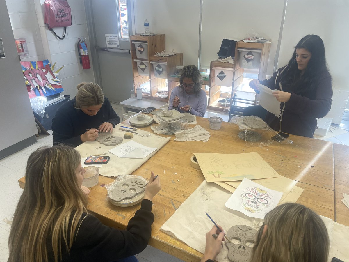 2nd semester Applied Art 1! Working he@are on their clay sugar skulls!