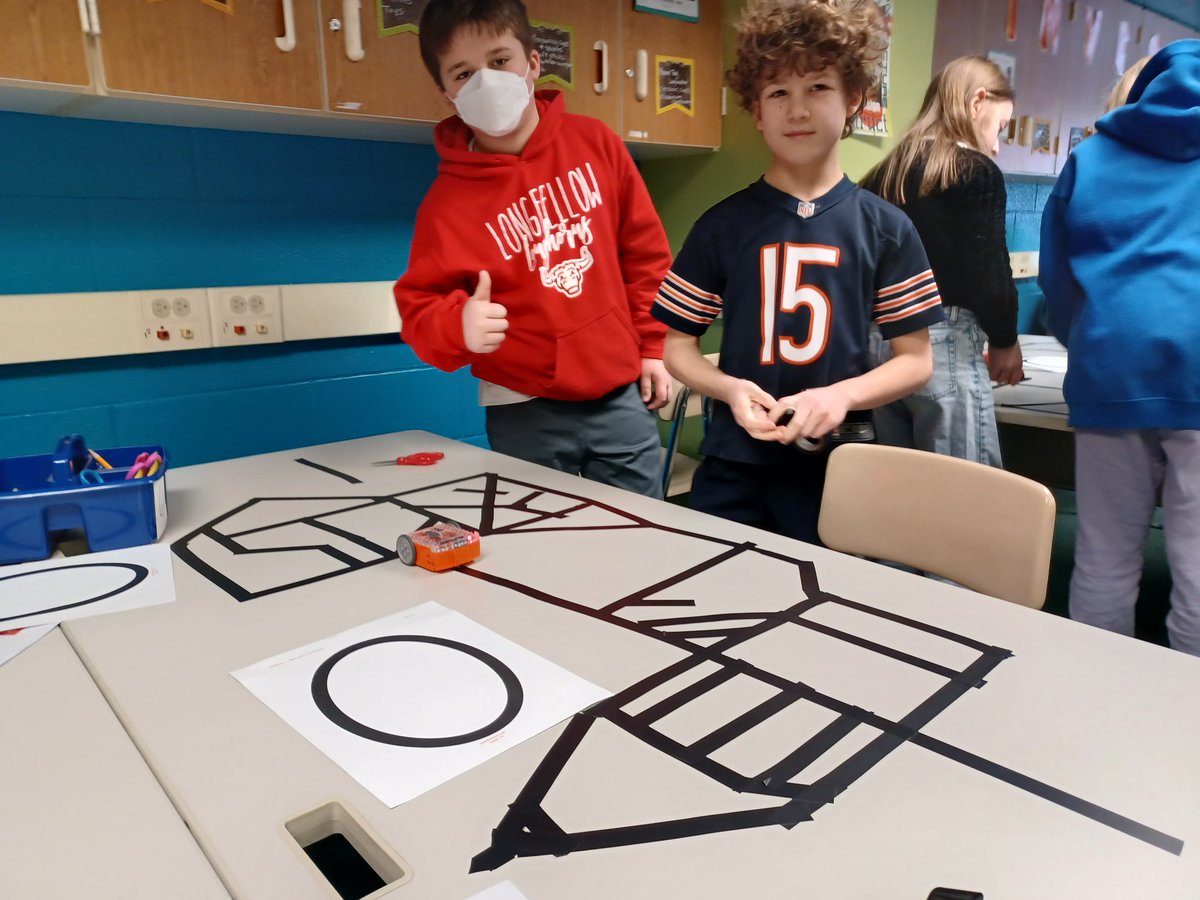 21longfellow's tweet photo. 4th graders are learning about robotics with our new Edison robots. In these pictures they are experimenting with creating lines for Edison to follow after scanning a barcode. There has been a lot of great collaboration and critical thinking already! #21Learns https://t.co/Q3G49jWG6Y