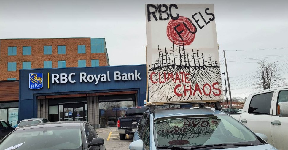 Today we used our new EV car signs! to expose and oppose RBC's funding of fossil fuels and the violation of Indigenous rights and sovereignty.  #Wetsuwetenstrongs #rbcfundsgenocide #defundcgl